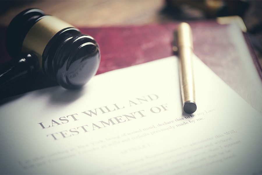 Fiduciary Bonds - Closeup View of a Last Will and Testament Document with a Pen and a Gavel on Top