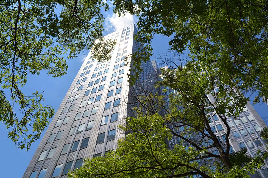 About Our Agency - Exterior View of E.R. Munro & Company Office Building in Pittsburgh Pennsylvania Next to Green Trees on a Sunny Day